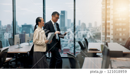 Tablet, window or business people in office with legal advisor for court case, documents or research. Walking, contract or mature lawyer in city with attorney feedback paperwork at law firm in Japan 121018959