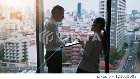 City, meeting and tablet with business people in Tokyo for collaboration, discussion or planning. Building, conversation and corporate with Japanese employee team at work for property development 121019008