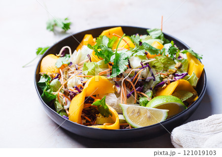 Vietnamese mango salad with nuts and vegetables. Vietnamese mango salad with nuts and vegetables. 121019103