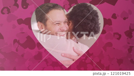 Image of hearts over diverse couple embracing Image of hearts over diverse couple embracing 121019425