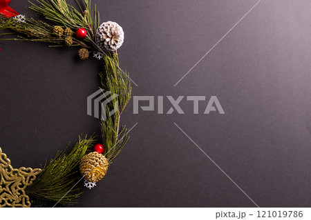 Christmas wreath with baubles and decorations with copy space on black background Christmas wreath with baubles and decorations with copy space on black background 121019786