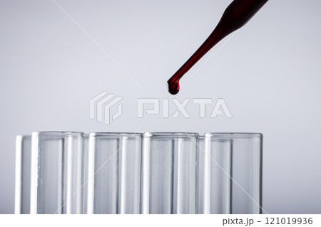 Close up of laboratory test tubes and pipette with copy space on white background Close up of laboratory test tubes and pipette with copy space on white background 121019936