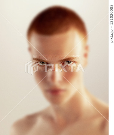 Contemporary art collage. Male face with a focused gaze, highlights the eyes in sharp clarity, contrasting with soft blur. Masculinity. 121020088