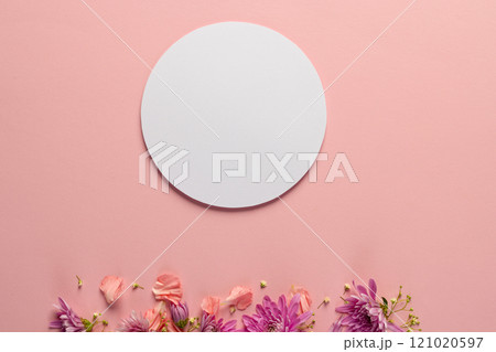 Pink flowers and white circle with copy space on pink background Pink flowers and white circle with copy space on pink background 121020597