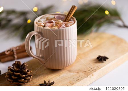 Mug of chocolate and marshmallows and christmas decorations with copy space 121020805