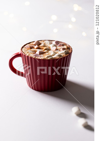 Vertical image of red christmas mug of chocolate and marshmallows with copy space Vertical image of red christmas mug of chocolate and marshmallows with copy space 121020812