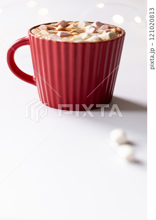 Vertical image of red christmas mug of chocolate and marshmallows with copy space Vertical image of red christmas mug of chocolate and marshmallows with copy space 121020813