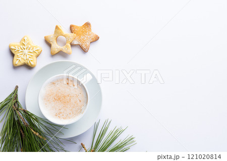 Cup of coffee and christmas decorations with copy space on white background Cup of coffee and christmas decorations with copy space on white background 121020814