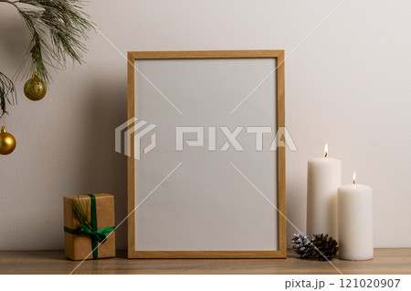 Christmas decorations and wooden frame with copy space on white background 121020907