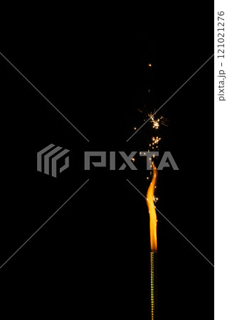 Close up of gas lighter with flames and copy space on black background 121021276