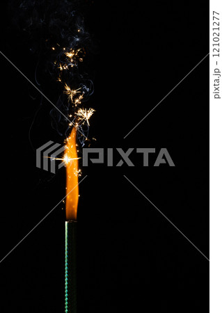 Close up of gas lighter with flames and copy space on black background Close up of gas lighter with flames and copy space on black background 121021277