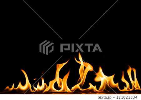 Yellow and orange flames and copy space on black background 121021334