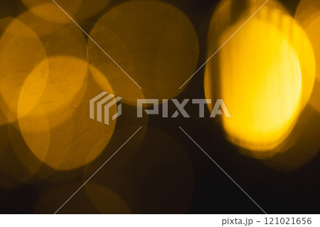 Yellow bokeh lights with copy space on dark background Yellow bokeh lights with copy space on dark background 121021656