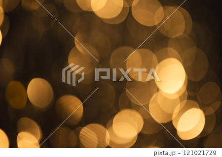 Yellow bokeh lights with copy space on dark background Yellow bokeh lights with copy space on dark background 121021729