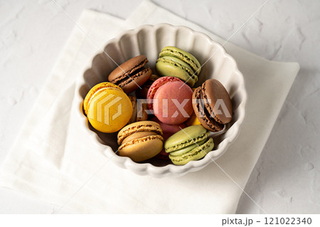 Macarons colorful cookies s in a bowl. Sweet dessert 121022340
