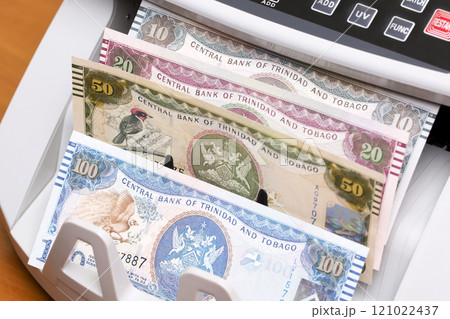 Trinidad and Tobago dollar in the counting machine Trinidad and Tobago dollar in the counting machine 121022437