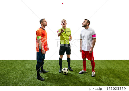 Referee standing between to players from opposite teams and tossing a coin to determine which team will kick off first Referee standing between to players from opposite teams and tossing a coin to determine which team will kick off first 121023559