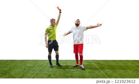 Young man, referee in green jersey, showing red card to man, soccer player, showing his disbelief and shock isolated on white background Young man, referee in green jersey, showing red card to man, soccer player, showing his disbelief and shock isolated on white background 121023612
