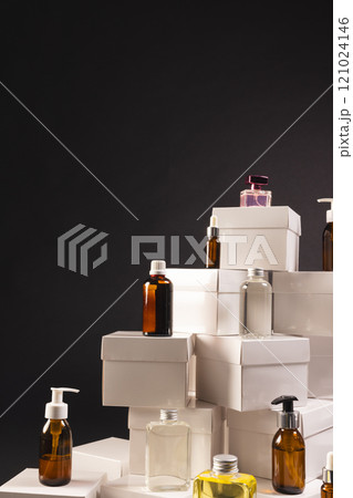 Vertical image of boxes with beauty products and copy space over black background Vertical image of boxes with beauty products and copy space over black background 121024146