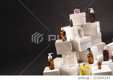 Boxes with beauty products and copy space over black background 121024147