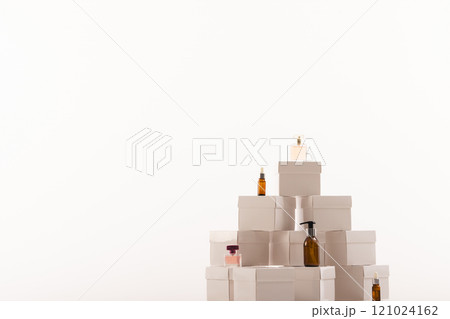 Boxes with beauty products and copy space over white background 121024162