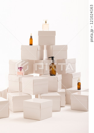 Vertical image of boxes with beauty products and copy space over white background 121024163