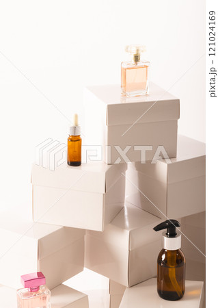 Vertical image of boxes with beauty products and copy space over white background Vertical image of boxes with beauty products and copy space over white background 121024169