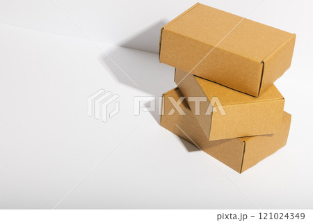 Stack of cardboard gift boxes with copy space over white background Stack of cardboard gift boxes with copy space over white background 121024349