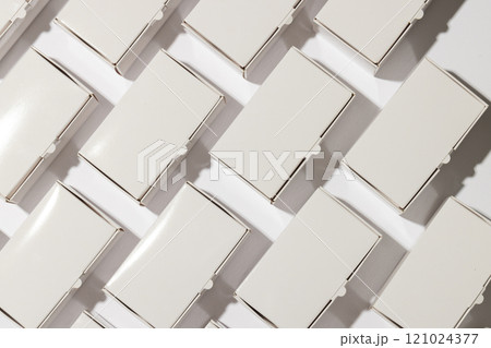 Rows of cardboard gift boxes with copy space over white background 121024377