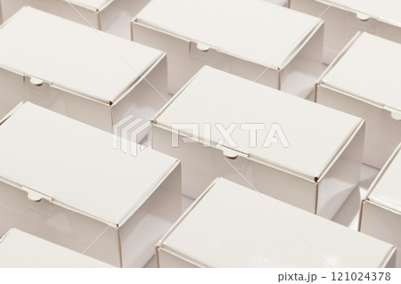 Rows of cardboard gift boxes with copy space over white background 121024378
