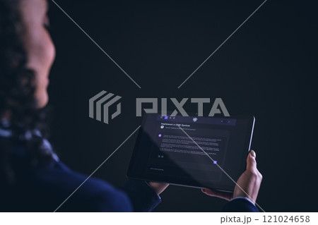 Biracial businesswoman using tablet with copy space on black background 121024658