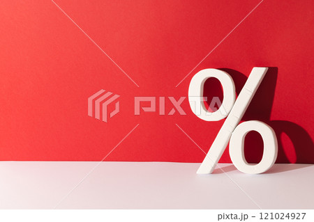 White percent sign with copy space against red background 121024927