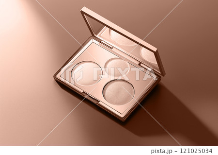 A mocha mousse brown beige compact shimmering eyeshadows on cocoa background. Modern trendy tone hue shade 121025034