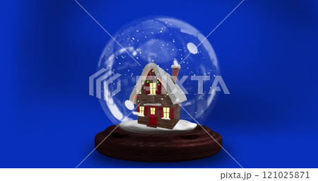 Image of christmas snow globe with house over blue background 121025871