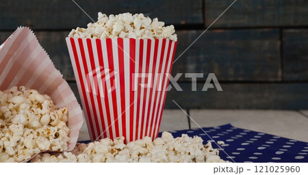 Image of boxes of popcorn over wooden wall Image of boxes of popcorn over wooden wall 121025960