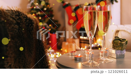 Abstract vector illustration of champagne glasses and gifts on table in living room Abstract vector illustration of champagne glasses and gifts on table in living room 121026011