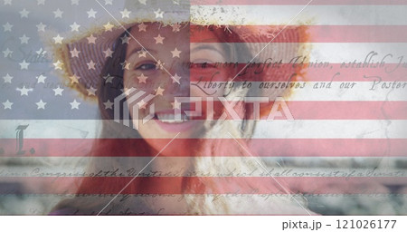 Constitution text and american flag against portrait of caucasian woman smiling in background 121026177