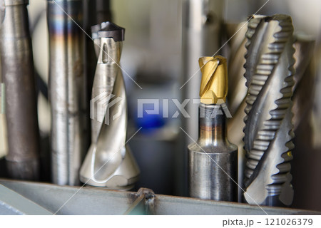 Close-up scene the group of used cutter end mill tools. Close-up scene the group of used cutter end mill tools. 121026379