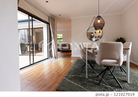 Modern dining room with elegant decor and cozy...の写真素材 [121027019] - PIXTA