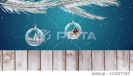 Image of road sign with copy space over decorations and snow falling on blue background 121027183