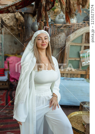 Portrait of a beautiful woman in Arabic clothing in Egypt during sunset. Portrait of a beautiful woman in Arabic clothing in Egypt during sunset. 121027374