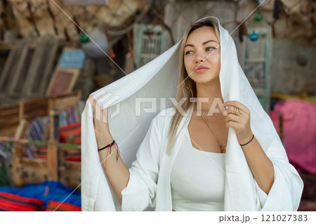 Portrait of a beautiful woman in Arabic clothing in Egypt during sunset. 121027383