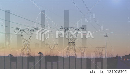 Transmission towers near a highway 4k 121028565