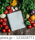 Blank notebook with fresh vegetables and fruits on rustic wooden table 121028771