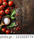 Fresh tomatoes with basil and sea salt on rustic wooden table 121028774