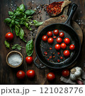 Fresh cherry tomatoes with basil and spices in cast iron skillet 121028776