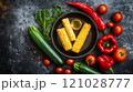 Fresh vegetables and corn on rustic background 121028777