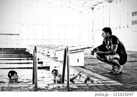 Coach and swimmers at the pool 121029297