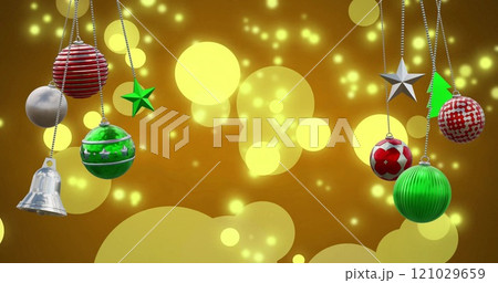 Image of christmas baubles over light spots on orange background Image of christmas baubles over light spots on orange background 121029659