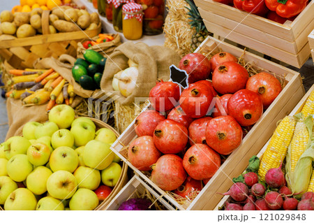 Assortment of fruits, vegetables displayed in baskets at farmers local market, showcasing seasonal harvest delights. 121029848
